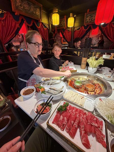 This photo captures a lively hot pot dinner at a restaurant on Korte Leidsedwarsstraat, Centrum, Amsterdam